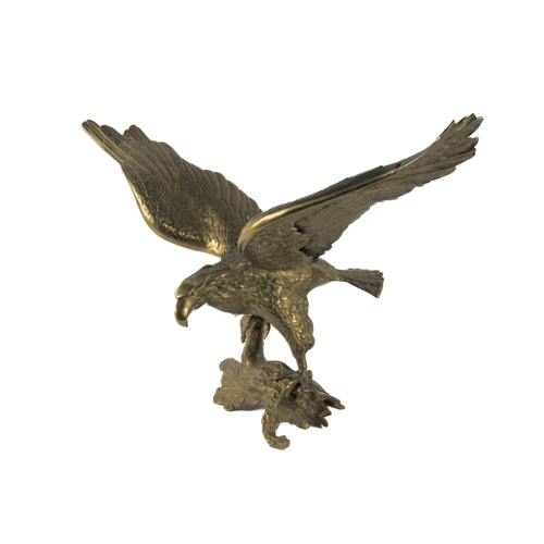 552 - A large gilded bronze Model, of perched eagle with wings out spanned, on a naturalistic branch base,... 