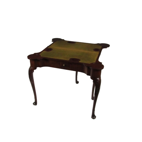 577 - A fine quality Irish Georgian period mahogany fold-over Card Table, the shaped top opening to reveal... 