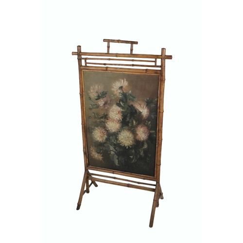 615 - A Victorian bamboo framed Firescreen, with inset floral painting, O.O.C., signed  E. Rice 1894. (1)P... 