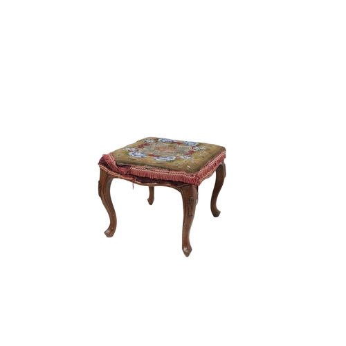 626 - A Victorian walnut framed Footstool, with beadwork padded seat on carved cabriole legs. (1)Provenanc... 