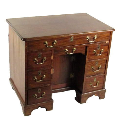 628 - A Georgian period mahogany Gentleman's kneehole Desk, of rectangular shaped moulded top above a long... 