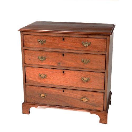 633 - A Georgian mahogany Chest, of four long drawers, the plain moulded top over graduating drawers ... 