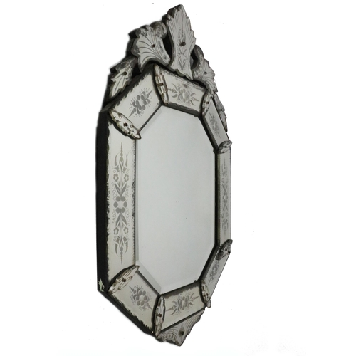 724 - An antique Venetian glass ornate Wall Mirror, with shaped cornice, etched panels, approx. 99cms x 59... 