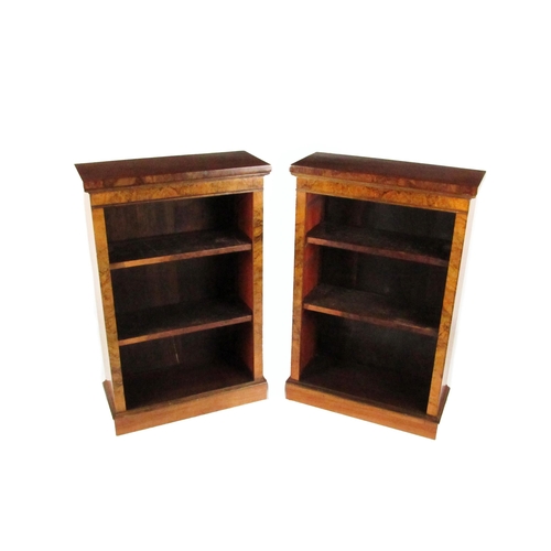 727 - An attractive pair of Victorian walnut narrow Open Bookcases, the moulded top over plain frieze with... 