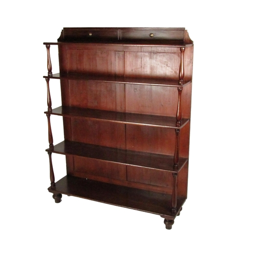 731 - An attractive 19th Century Irish mahogany Waterfall Open Bookcase, with shaped panelled top above fi... 