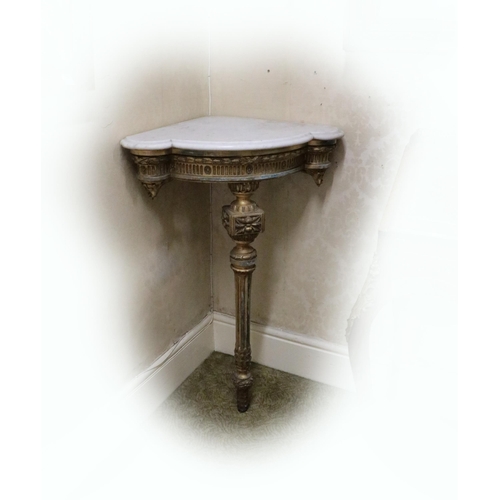 736 - A pair of 19th Century English giltwood Corner Console Tables, each with moulded shaped white marble... 