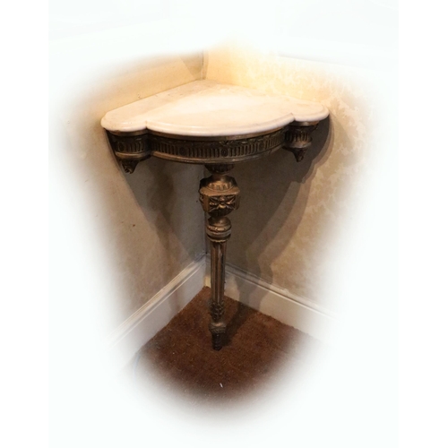 736 - A pair of 19th Century English giltwood Corner Console Tables, each with moulded shaped white marble... 