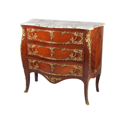 739 - A French style kingswood bombe shaped Commode, the moulded marble top over three long drawers with o... 