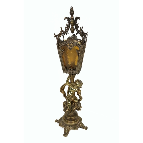 770 - A 19th Century brass Lantern Lamp, with coloured glass and decorative ormolu shade, with cherub supp... 