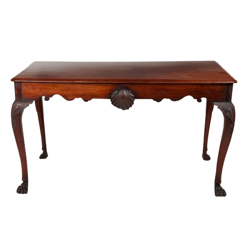 780 - A fine quality early 19th Century Irish mahogany Side Table, the plain moulded top over a shaped fri... 