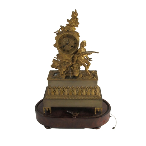 789 - An attractive 19th Century French ormolu figural Mantle Clock, the top with assimilated cliff with b... 