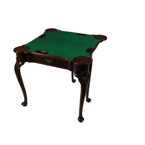 798 - An Irish Georgian period mahogany fold-over Card Table, the shaped top opening to reveal a baize cov... 