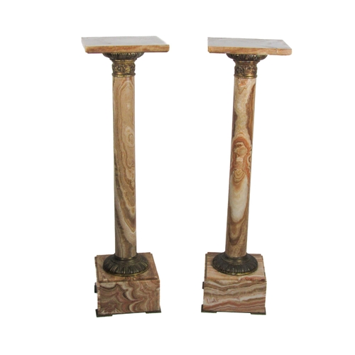 819 - A fine quality pair of marble pillar Stands, the square tops over ormolu tops and bottoms with egg n... 