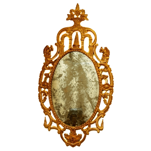 832 - An important and fine quality Irish 18th Century carved giltwood ornate oval Mirror, probably by Jac... 