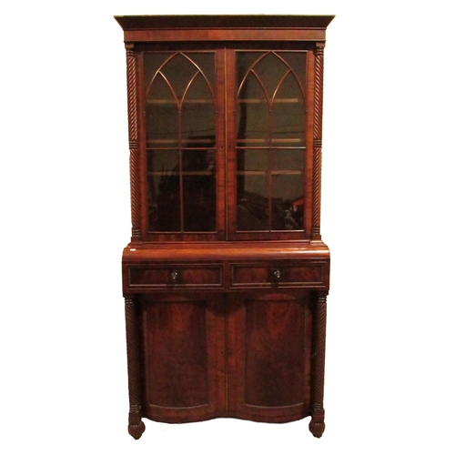 847 - A good Nelson period mahogany Bookcase, with moulded cornice above two Gothic glazed doors flanked w... 