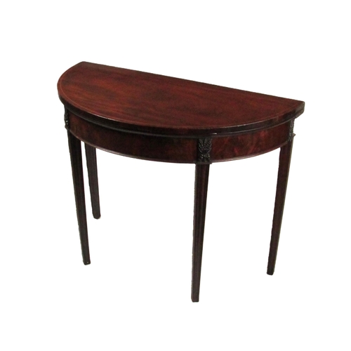 851 - A 19th Century mahogany Sheraton demi-lune fold-over Card Table, the top with slim string inlay over... 