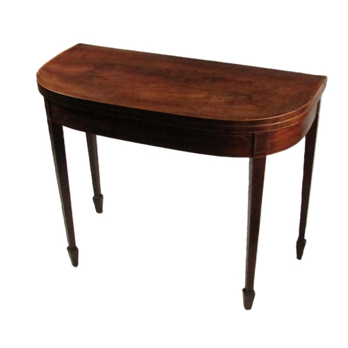 853 - A 19th Century mahogany demi-lune fold-over Card Table, the top with slim border crossbanding and co... 