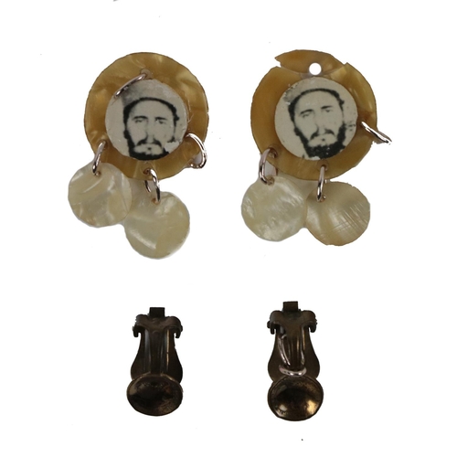 666 - [Castro (Fidel)] a pair of clip-on Ear-rings, of unusual design , each bearing a photographic image ... 