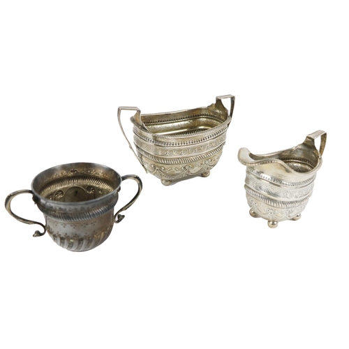 14 - A Georgian English silver Sugar Bowl, and cream Jug of embossed and edged design, hallmarked London,... 