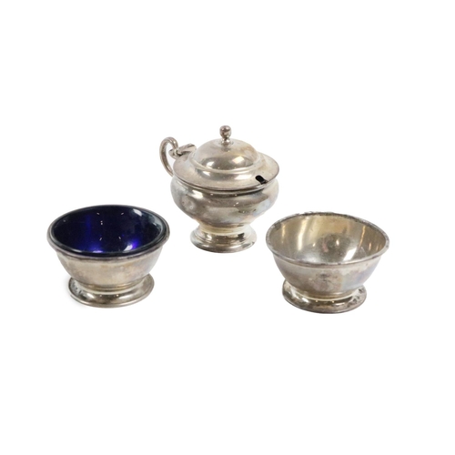 29 - A three-piece silver Condiment Set, London c. 1910/1911, consisting of a mustard pot and a pair of s... 