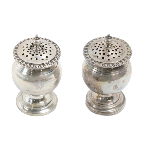 30 - A pair of silver Pepper Pots, London c. 1909, by Wakely & Wheeler,  with globular shap... 