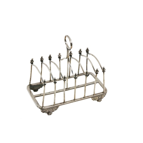 72 - A silver large Toast Rack, Sheffield c. 1828, by John & Thomas Settle, with a rectangular open f... 