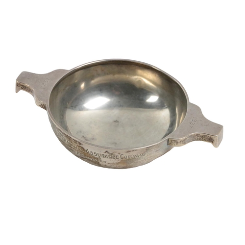 75 - A silver Quaich, Birmingham c. 1937, of typical style with plain circular shallow bowl supported on ... 