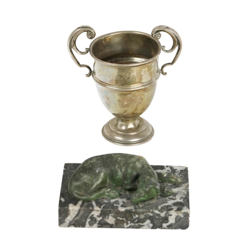 85 - A silver two handled Trophy Cup, and a bronze Model of a sleeping dog, on a marble rectangular base.... 