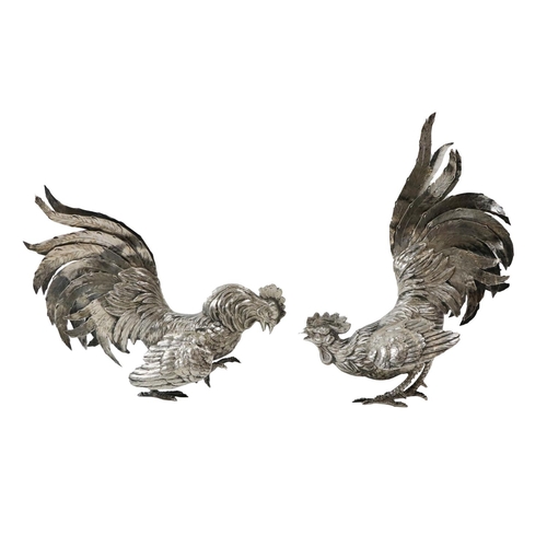 89 - A pair of Continental silver Fighting Cockerels, stamped 800 (German) with realistic chased feathers... 