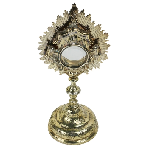 101 - An important 18th Century etched and decorated silver gilt Monstrance, the base with floral design a... 