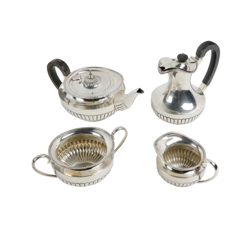 109 - A Sheffield silver four piece Tea Service, consisting of a Teapot, Hot Water Jug, Sugar Bowl and Cre... 