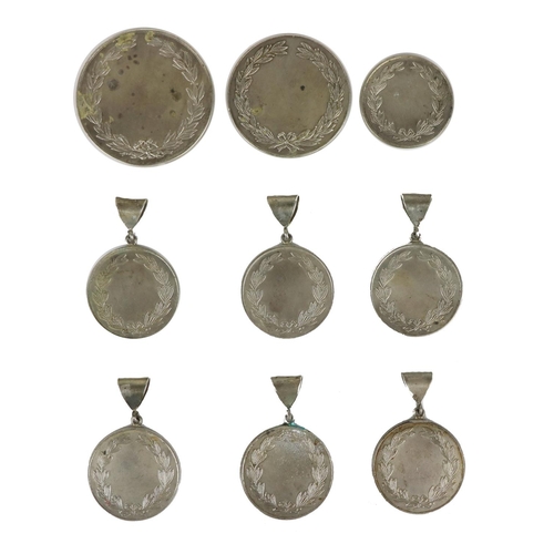 147 - A collection of 7 small Irish silver Presentation Medals, and two larger others, hallmarked, as a lo... 