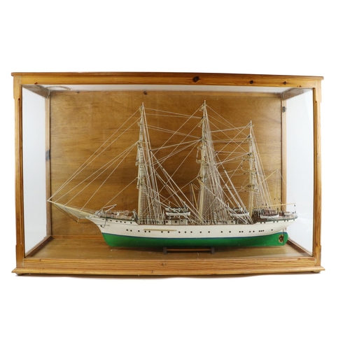 159 - A large cased Model, of a mast ship painted green and white, approx. 69cms high x 112cms wide x 36cm... 