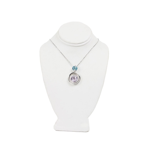 190 - An attractive Ladies white gold Chain, with white gold pendant set with French cut amethyst and blue... 