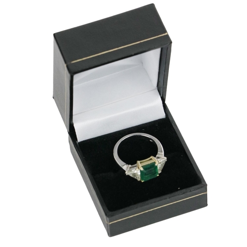 191 - A fine quality Ladies emerald and diamond Ring, the central large  emerald (approx. 2.22ct) fla... 