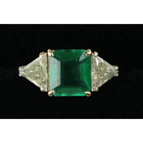 191 - A fine quality Ladies emerald and diamond Ring, the central large  emerald (approx. 2.22ct) fla... 