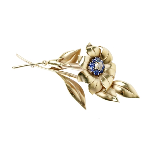 198 - An attractive Ladies 9ct gold Flower Brooch, the top inset with a 5.5mm round old cut diamond .63ct,... 