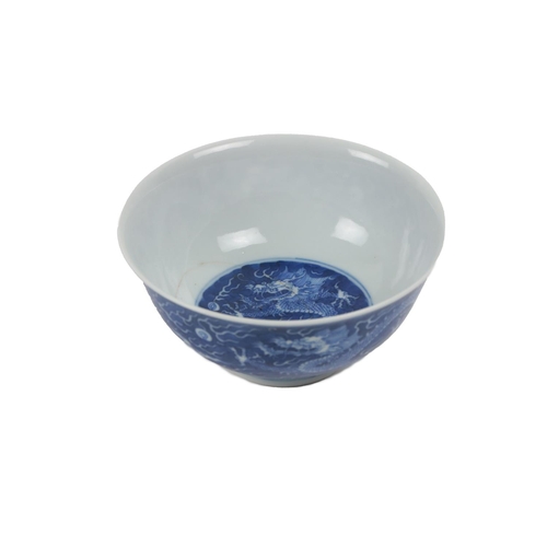 224 - An early Chinese blue and white 'Dragon' Bowl, the interior with medallion design of floating five c... 