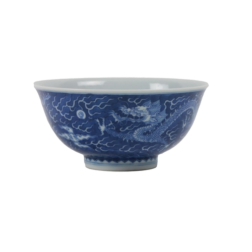 224 - An early Chinese blue and white 'Dragon' Bowl, the interior with medallion design of floating five c... 