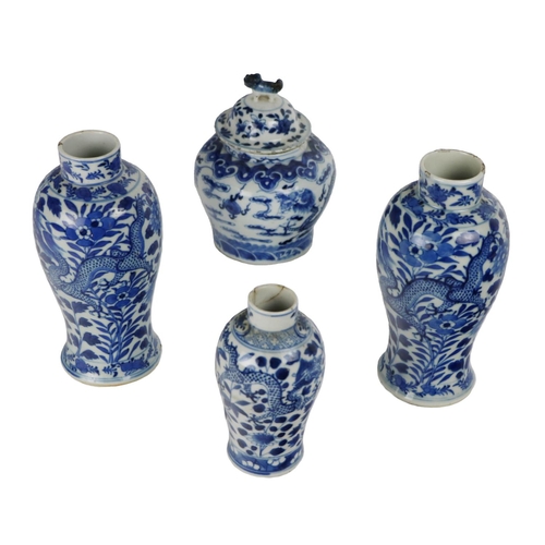 255 - A pair of 19th Century blue and white bulbous Vases, decorated with dragons, flowers, four character... 