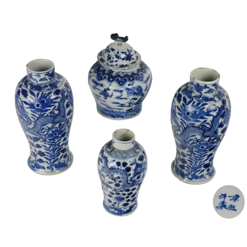 255 - A pair of 19th Century blue and white bulbous Vases, decorated with dragons, flowers, four character... 