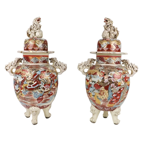 261 - A pair of 20th Century cream ground Japanese Satsuma Vases and covers, the dome top lid with mythica... 