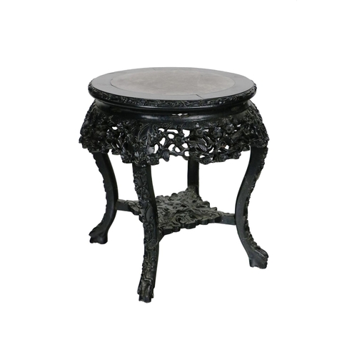 267 - A 20th Century Chinese hardwood Jardinière Stand, with circular marble top inset, with carved and pi... 