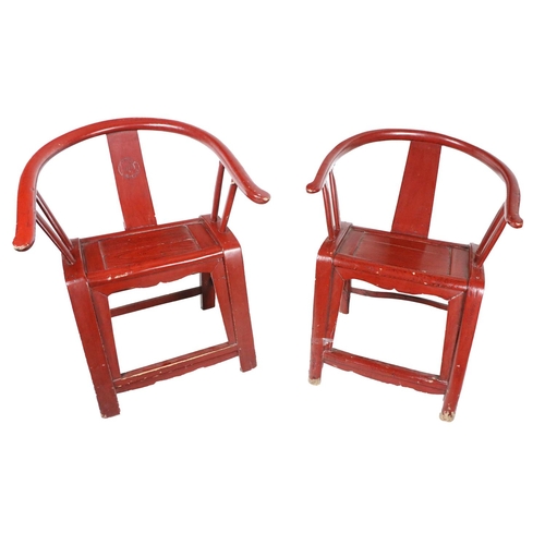 269 - A pair of 19th Century Chinese horse-shoe shaped rustic design wooden Chairs, painted red. (2)... 