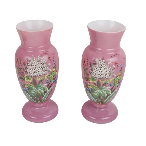 294 - A pair of painted milk glass Vases, the pink ground with painted floral bouquet overlay, each approx... 