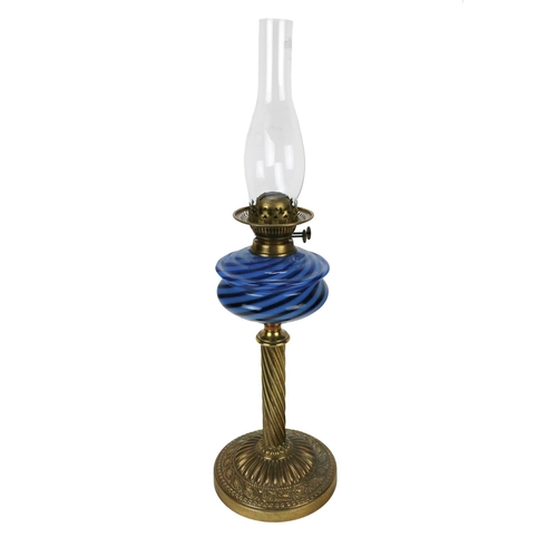 298 - An Edwardian brass gas Lamp, with blue glass reservoir, twisted column on heavy embossed circular ba... 