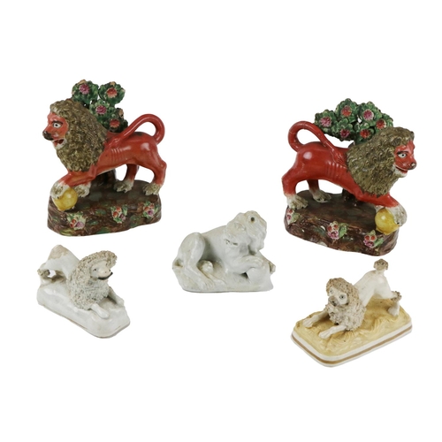 313 - A pair of 19th Century coloured Staffordshire Rampant Lions, and three other similar ornaments. (5)... 