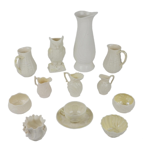 323 - [Belleek & Co.] A collection of varied creamware Porcelain, including jugs, vases, bowls, cup an... 