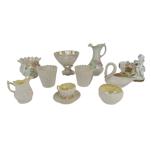 326 - A varied collection of Belleek Ware, comprising basket ware Bowl, floral encrusted Jugs, Cups etc., ... 