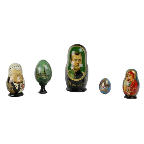 335 - A large painted wooden Russian Doll, each graduating, decorated with members of the Tsars, also a sm... 